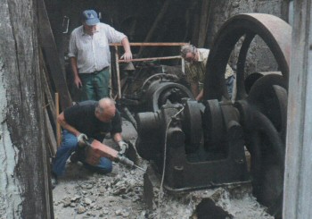 Gas Engine being removed from artisan's workshop