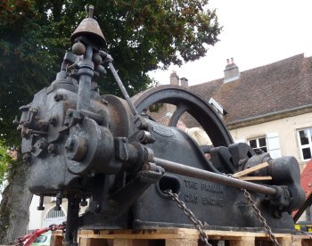 Gas Engine loaded on lorry after removal from artisan's workshop